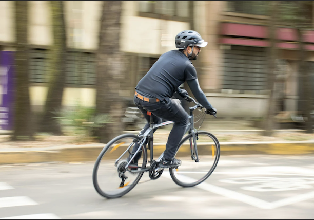 Person cycling as a sustainable daily commute habit